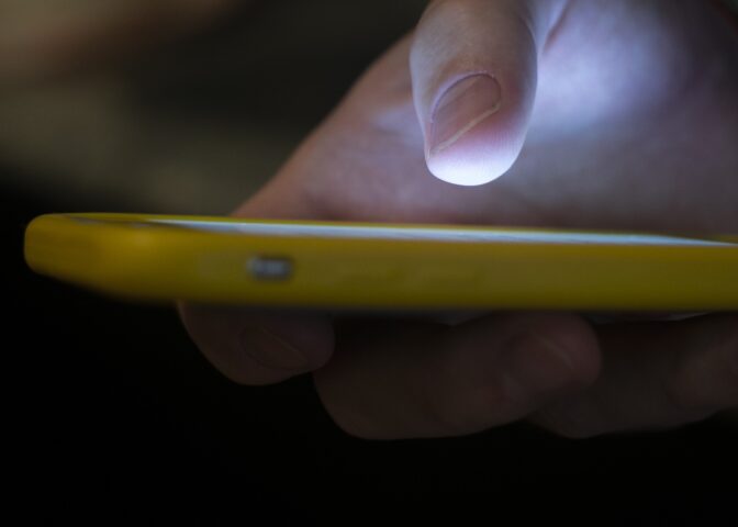 In this Aug. 11, 2019 file photo, a man uses a cell phone in New Orleans.