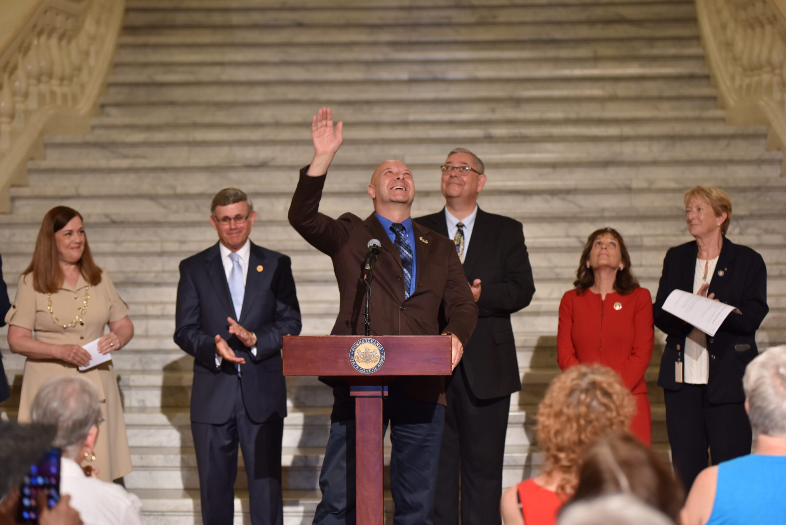 State Sen. Doug Mastriano (R-Franklin), the 2022 Republican candidate for governor, waves to members of a crowd gathered for a rally celebrating William Penn in the state Capitol rotunda in Harrisburg on July 1, 2022. 