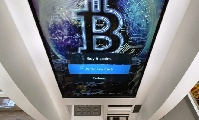 In this Feb. 9, 2021, photo, the Bitcoin logo appears on the display screen of a cryptocurrency ATM at a store in Salem, N.H. California on Wednesday, May 4, 2022. 