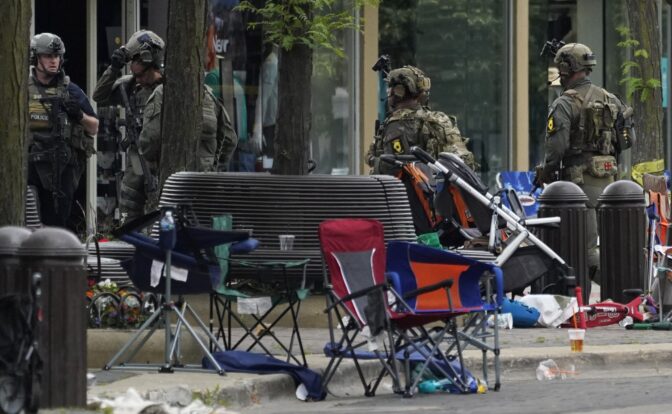 Law enforcement search after a mass shooting at the Highland Park Fourth of July parade in downtown Highland Park, a Chicago suburb on Monday, July 4, 2022.