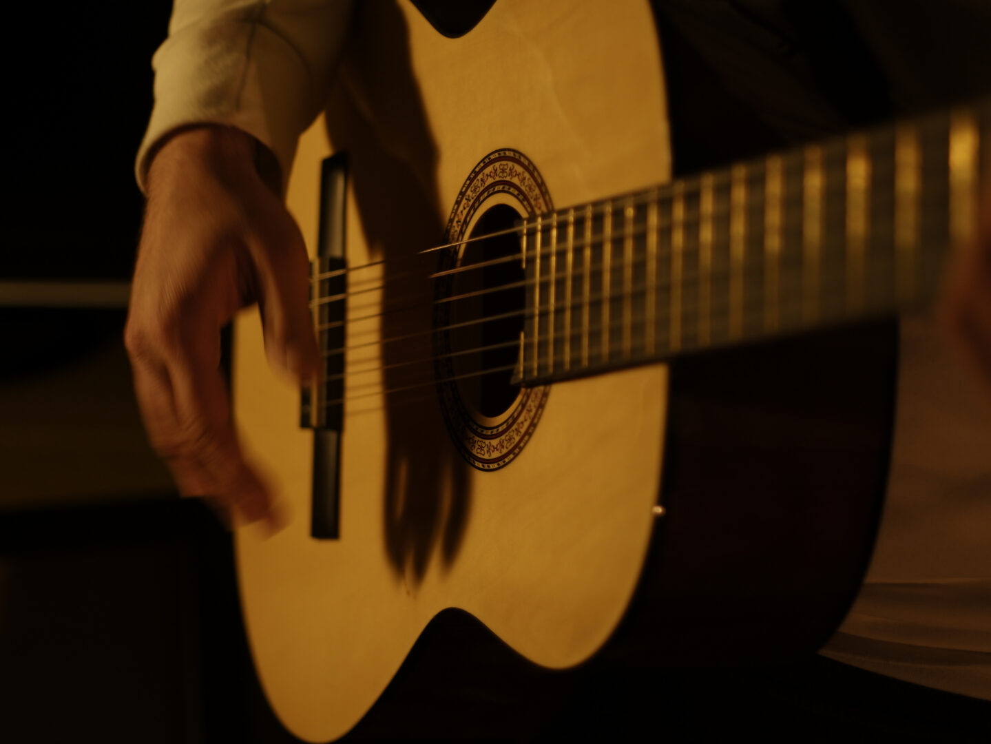 Playing classical guitar, flamenco style, dark concept, elegance