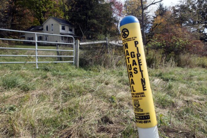 A marker designates where a natural gas pipeline runs near a home in Valencia, Pennsylvania on Wednesday, Oct. 14, 2020.