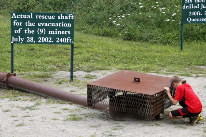 A visitor to the Quecreek Mine Rescue Visitors Center, in Somerset, Pa., on July 28, 2012, looks at the rescue shaft that was used to pull nine miners to safety on July 28, 2002, after they were trapped for 78 hours in a flooded portion of the Quecreek Mine.