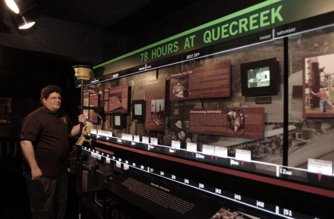 In this May 3, 2006 file photo, then director of Windber Coal Heritage Center, Christoper Barkley, stands near the 78 hours at Quecreek exhibit that chronicled the timeline of the rescue of nine coal miners trapped underground in July of 2002, at the center in Windber, Pa.