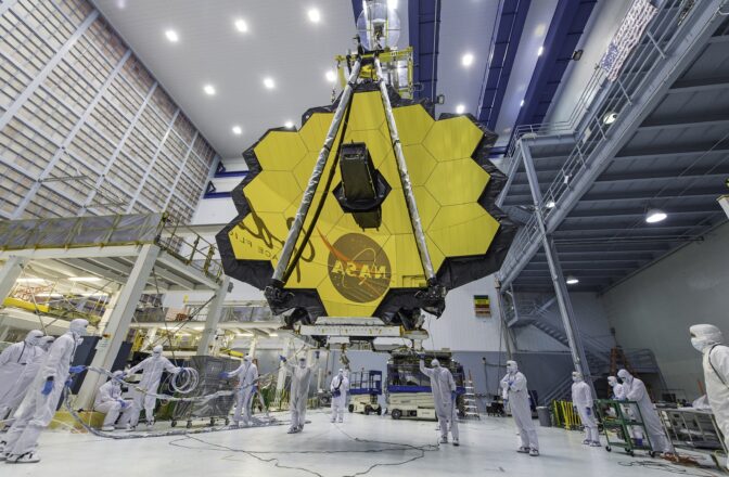 In this April 13, 2017, photo provided by NASA, technicians lift the mirror of the James Webb Space Telescope using a crane at the Goddard Space Flight Center in Greenbelt, Md.