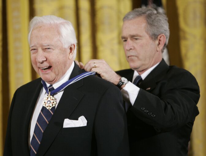 President George W. Bush, right, bestows the Presidential Medal of Freedom to author and historian David McCullough during a ceremony in the East Room of the White House in Washington, Dec. 15, 2006.