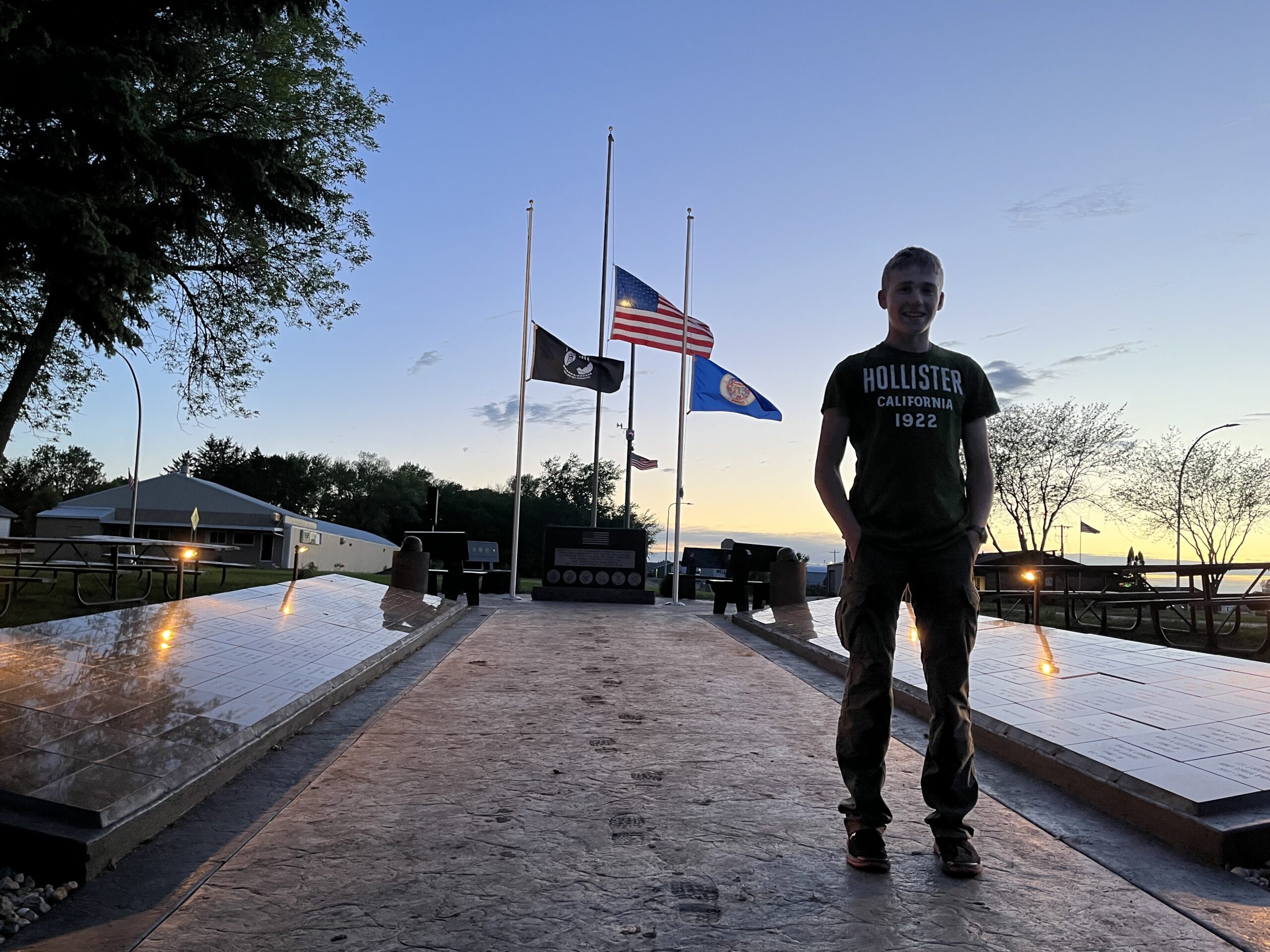 Dominique Claseman stands in front of the memorial he built for his Eagle Scouts project.
