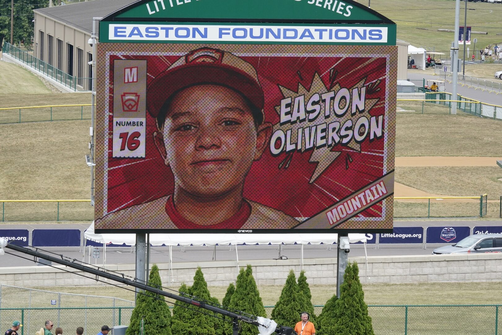 A picture of Mountain Region Champion Little League team member Easton Oliverson, from Santa Clara, Utah, is shown on the scoreboard at Volunteer Stadium during the opening ceremony of the 2022 Little League World Series baseball tournament in South Williamsport, Pa., Wednesday, Aug 17, 2022. Oliverson was injured when he fell out of a bunk bed at the dormitory complex. 