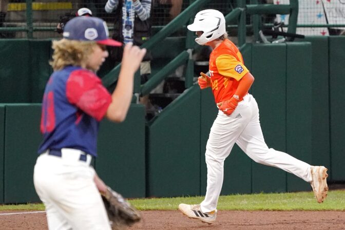 Hollidaysburg, Pa.'s Chase Link rounds third base on his two run home run off of Hollidaysburg, Pa. pitcher Chase Link, left, during the sixth inning of a baseball game at the Little League World Series tournament in South Williamsport, Pa., Wednesday, Aug. 24, 2022. Texas won 8-4.