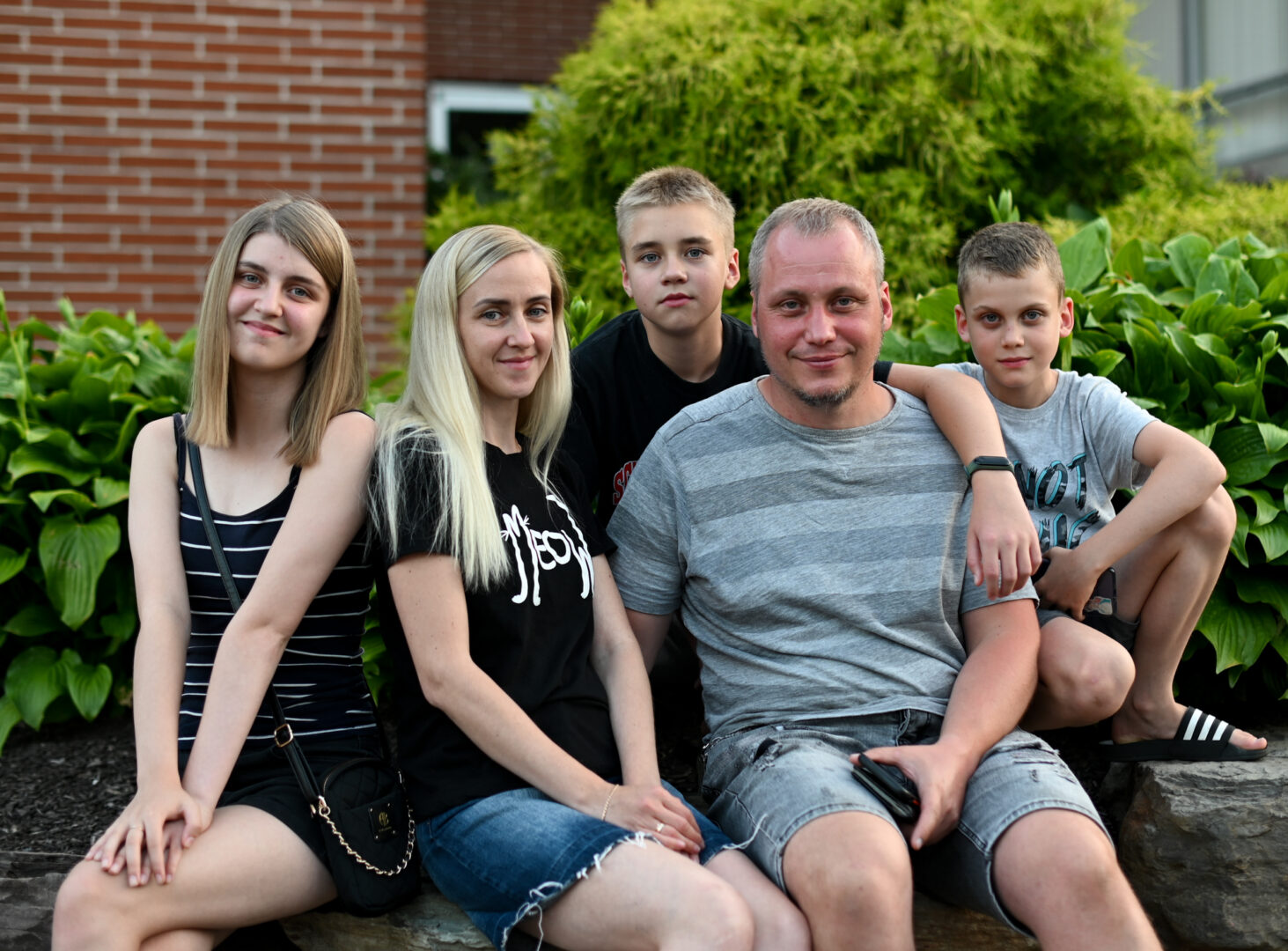 The Chekh family poses for a picture after an English class for Ukrainian refugees at Bethany Slavic Church in Ephrata on Tuesday, July 19, 2022.