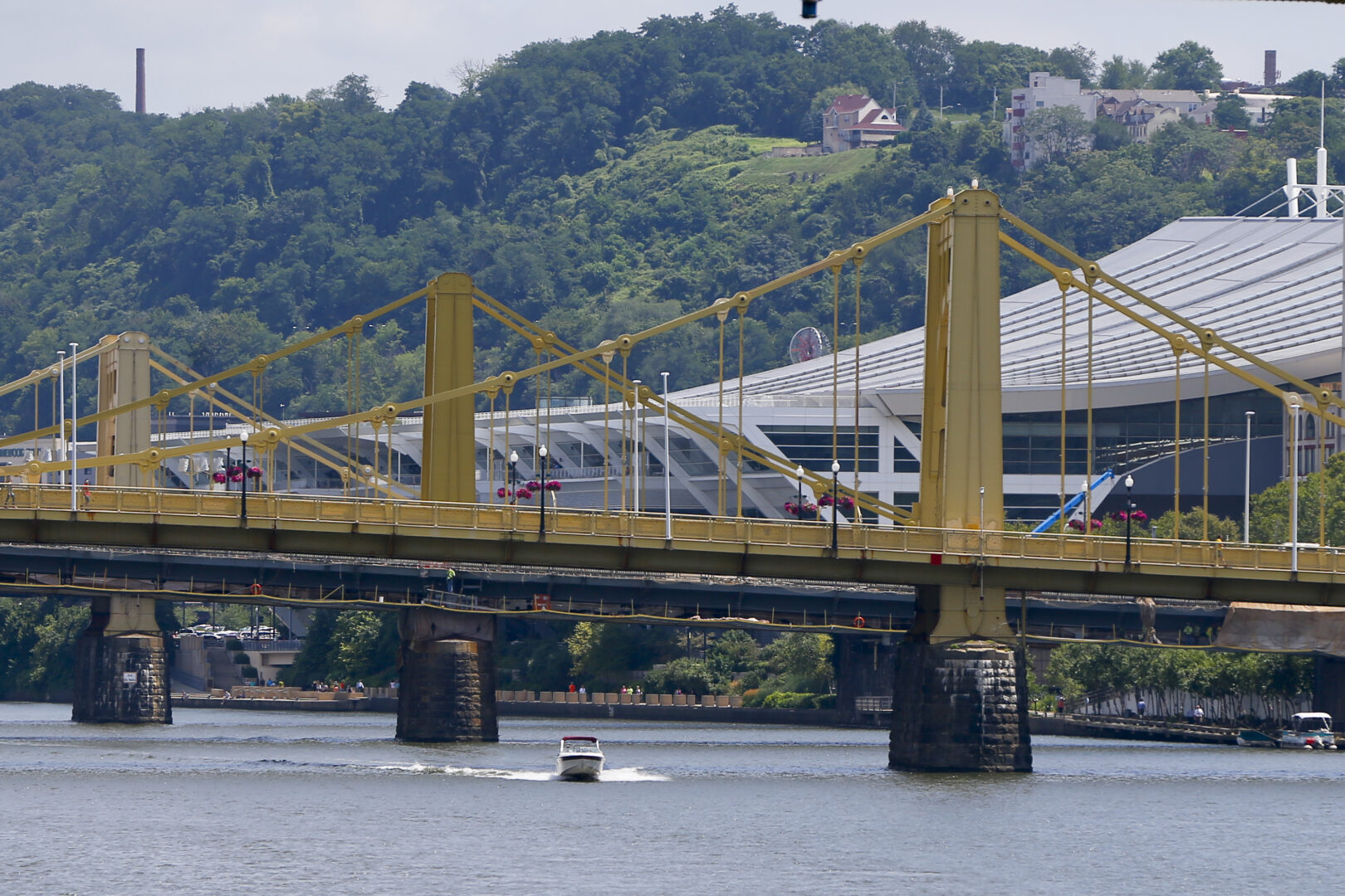 The sloping roof of the Pittsburgh Convention Center is visible behind the Three Sisters Bridges along the Allegheny River, Wednesday, July 26, 2017. 