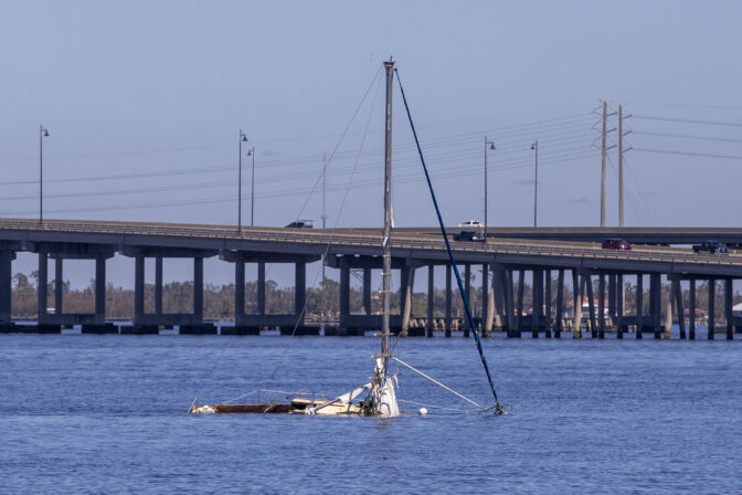 A boat submerged in the middle of the Peace River in Punta Gorda Florida after hurricane Ian on September 30, 2022.