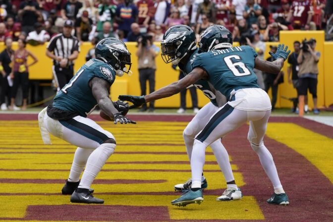 Philadelphia Eagles wide receiver A.J. Brown (11) celebrating his touchdown with teammates during the first half of an NFL football game against the Washington Commanders, Sunday, Sept. 25, 2022, in Landover, Md.
