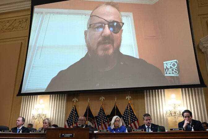 Stewart Rhodes, founder of the Oath Keepers, is seen on a screen during a House Select Committee hearing to Investigate the January 6th Attack on the Capitol in June. Brendan Smialowski/AFP via Getty Images