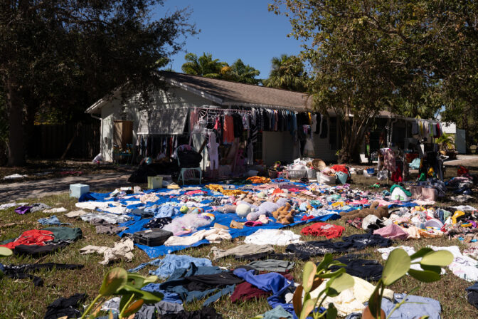Clothes dry out in the lawn of a home flooded by storm surge from Hurricane Ian on October 2, 2022 
