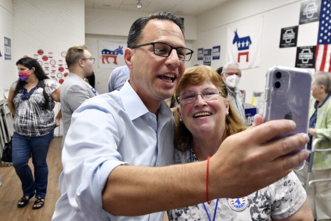 Josh Shapiro, Pennsylvania's Democratic nominee for governor, records a video message on Cindy Barnes' cell phone for children after he spoke at a campaign event at Franklin County Democratic Party headquarters, Sept. 17, 2022, in Chambersburg, Pa.