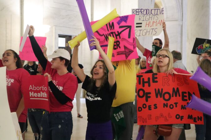 Protestors rally outside the Senate chamber at the West Virginia state Capitol in Charleston, W.Va., as lawmakers debated a sweeping bill to ban abortion in the state with few exceptions on Tuesday, Sept. 13, 2022.