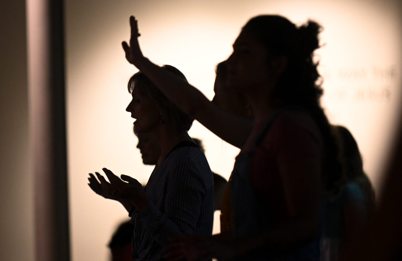 People worship during the service at World Harvest Outreach Church in Chambersburg