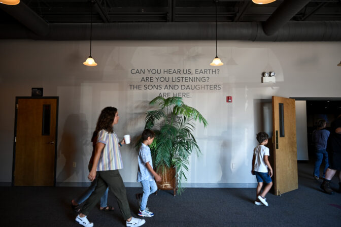 People head into the auditorium before the start of the service at World Harvest Outreach church in Chambersburg 