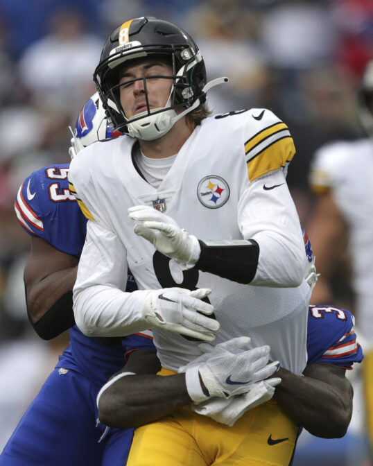 Pittsburgh Steelers quarterback Kenny Pickett is hit by Buffalo Bills linebacker Tyrel Dodson