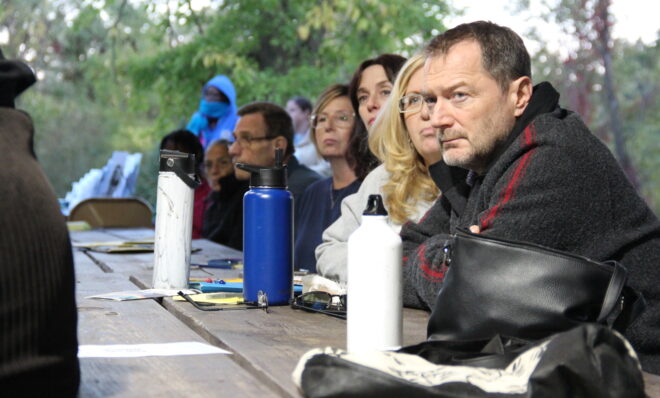 Kurt Blanock, right, watches a public forum on state-funded fracking health studies in Canonsburg, Pa., October 5, 2022. Blanock's son, Luke, died of a rare cancer in 2016. Photo: Reid R. Frazier / The Allegheny Front.