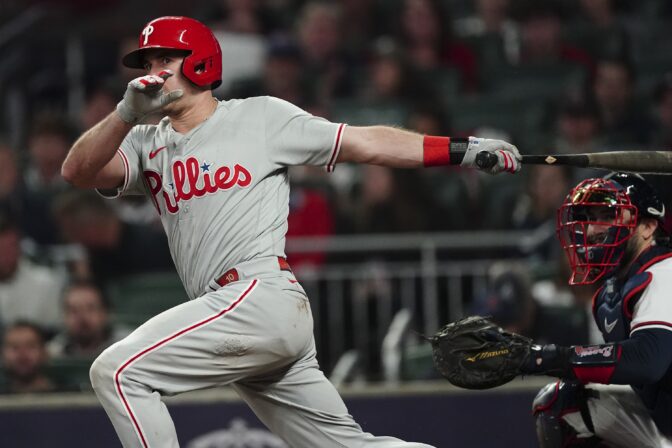 Philadelphia Phillies catcher J.T. Realmuto (10) swings during the sixth inning in Game 2 of baseball's National League Division Series between the Atlanta Braves and the Philadelphia Phillies, Wednesday, Oct. 12, 2022, in Atlanta.