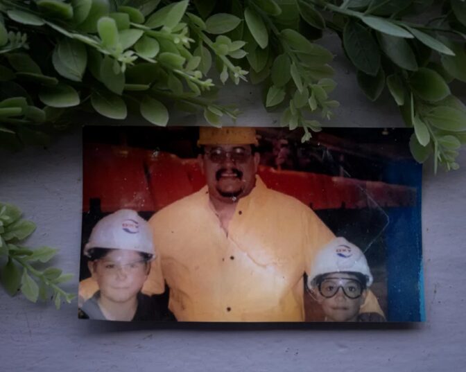 Saenz with his two young sons on a tour of the OxyChem plant in the early 2000s. Henry Jr., right, later took a job there.