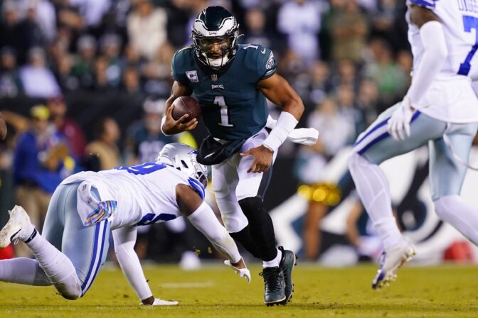 Philadelphia Eagles' Jalen Hurts runs with the ball during the second half of an NFL football game against the Dallas Cowboys on Sunday, Oct. 16, 2022, in Philadelphia.