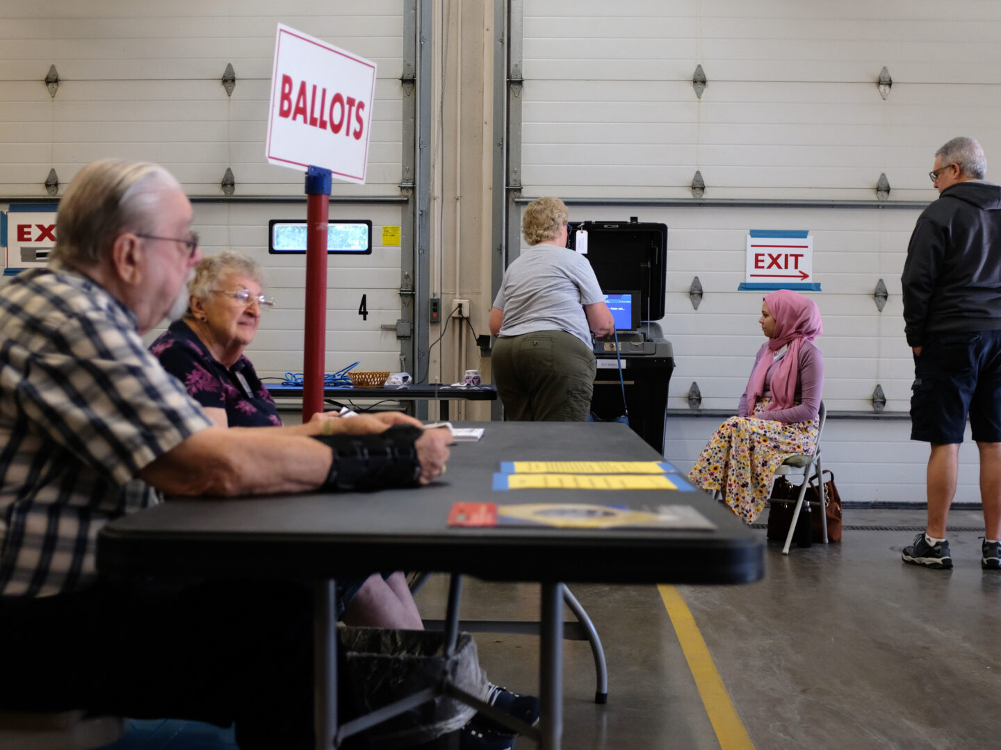 MILWAUKEE, WI - AUGUST 09: Poll workers and voters participate during Wisconsins state primary day on August 9, 2022 at the Village Hall of Waukesha in Waukesha, WI. The race is expected to be tight with both Republican candidates Tim Michels who has been endorsed by former President Donald Trump, and Rebecca Kleefisch who as been endorsed by former Vice President Mike Pence. ((Photo by Alex Wroblewski/Getty Images)