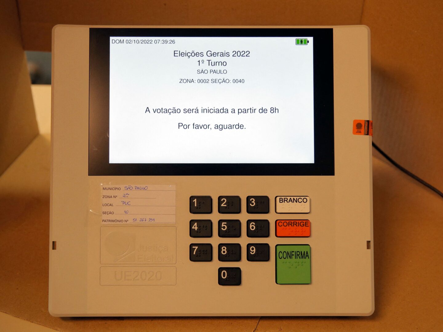 Picture of an electronic voting machine taken as Electoral Justice employees prepare a polling station during the legislative and presidential election, in Sao Paulo, Brazil, on October 2, 2022. - Voting began early Sunday in South America's biggest economy, plagued by gaping inequalities and violence, where voters ar expected to choose between far-right incumbent Jair Bolsonaro and leftist front-runner Luiz Inacio Lula da Silva, any of which must garner 50 percent of valid votes, plus one, to win in the first round. (Photo by CAIO GUATELLI / AFP) (Photo by CAIO GUATELLI/AFP via Getty Images)