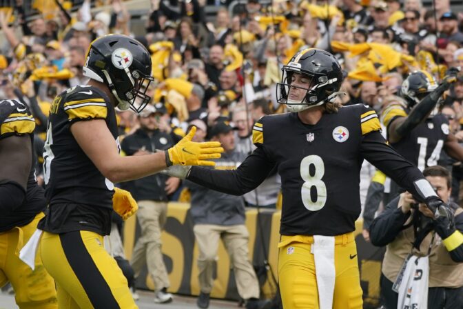Pittsburgh Steelers quarterback Kenny Pickett (8) is congratulated by tight end Pat Freiermuth (88) after diving cross the goal to score against the New York Jets during the second half of an NFL football game, Sunday, Oct. 2, 2022, in Pittsburgh.