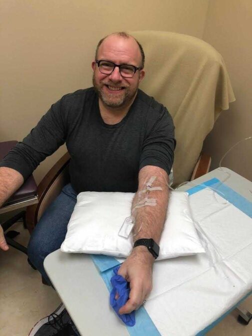 Phil Gutis getting an infusion of Aduhelm.