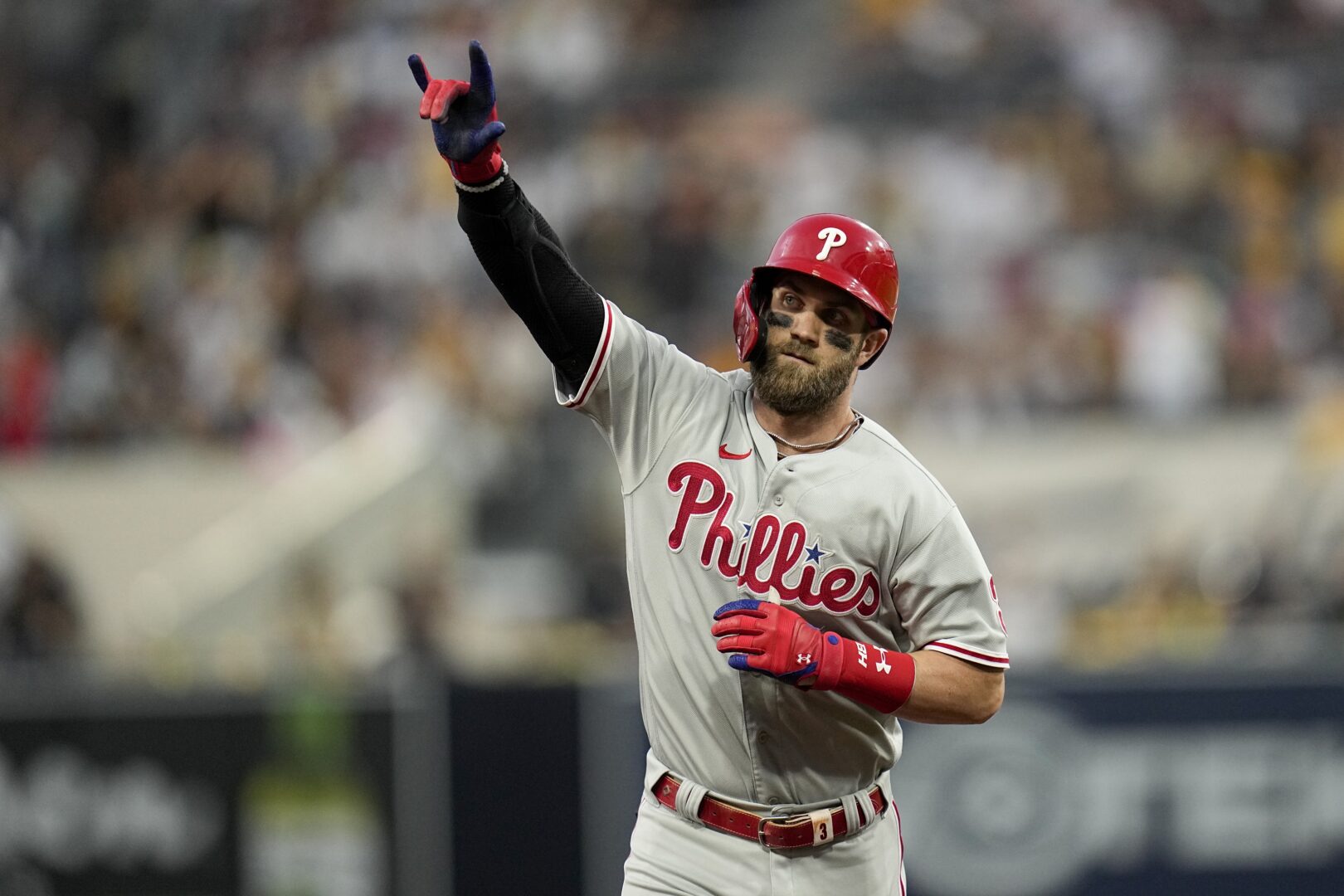 Philadelphia Phillies' Bryce Harper celebrates after a home run during the fourth inning in Game 1 of the baseball NL Championship Series between the San Diego Padres and the Philadelphia Phillies on Tuesday, Oct. 18, 2022, in San Diego. 