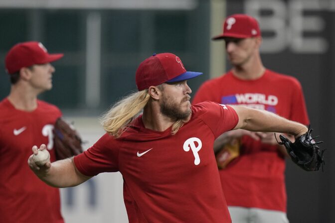 Philadelphia Phillies Noah Syndergaard warms up during batting practice before Game 1 of baseball's World Series between the Houston Astros and the Philadelphia Phillies on Friday, Oct. 28, 2022, in Houston.
