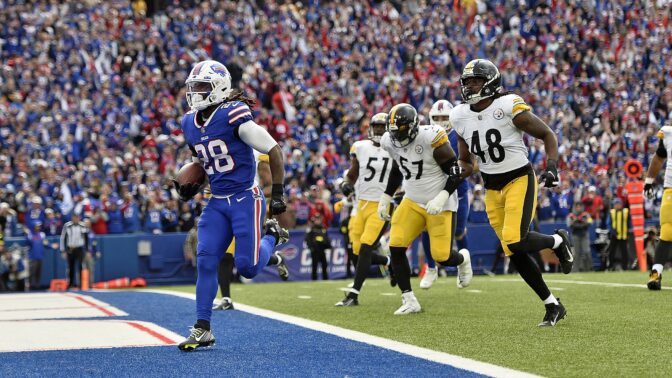 Buffalo Bills running back James Cook (28) gets past Pittsburgh Steelers defenders for a touchdown during the second half of an NFL football game in Orchard Park, N.Y., Sunday, Oct. 9, 2022.