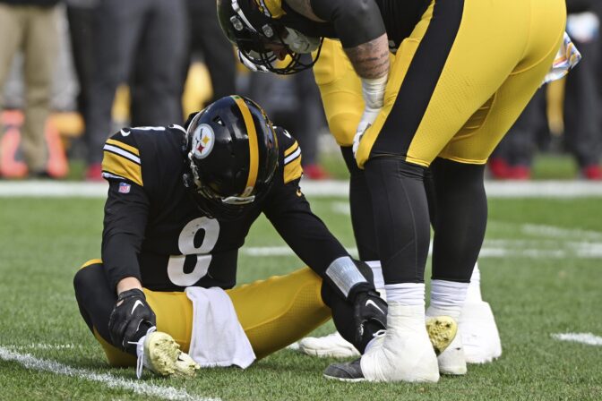 Pittsburgh Steelers quarterback Kenny Pickett (8) is helped on the field after being injured during the second half of an NFL football game against the Tampa Bay Buccaneers in Pittsburgh, Sunday, Oct. 16, 2022.