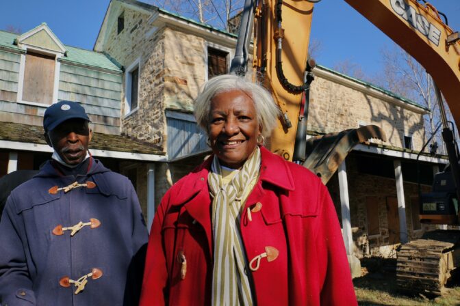 Linda Salley, president and executive director of the African American Museum of Bucks County, stands before the 300-year-old farmhouse that will become the museum’s home. She is joined by her husband, Alonzo Salley.