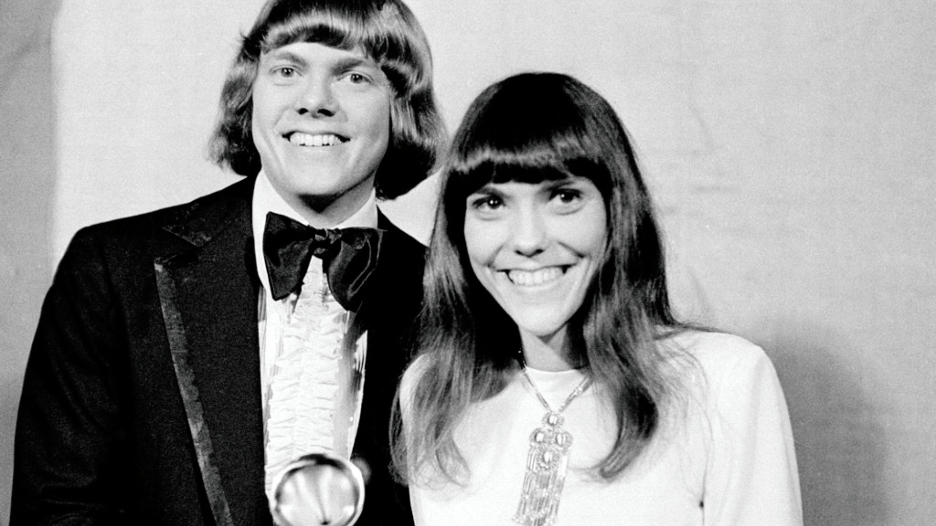 FILE - In this March 17, 1971 file photo, Richard and Karen Carpenters of The Carpenters pose with their Grammy during the 13th annual 1970 Grammy Awards in Los Angeles. The brother-sister duo was named best new artist of the year, 1970, and also won as the best contemporary duo or group vocalists for 
