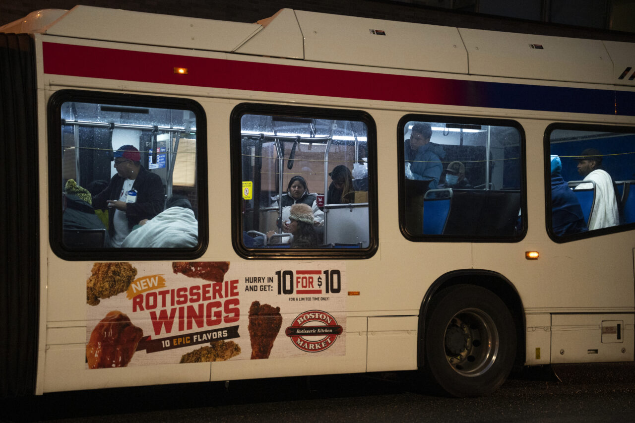 Migrants sent by Texas Gov. Greg Abbott arrive near 30th Street Station Wednesday morning, Nov. 16, 2022, in Philadelphia. Abbott has sent the buses to Democratic-led cities as a way to maximize exposure over what he says is inaction by the Biden administration over high numbers of migrants crossing on the southern border. (AP Photo/Joe Lamberti)