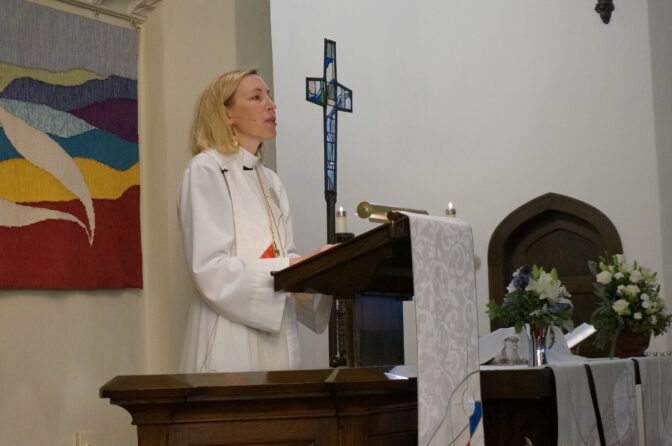 The Rev. Ingrid Rasmussen, pastor at Holy Trinity Lutheran Church in Minneapolis, preaches to her congregation during Sunday, Nov. 6, 2022, worship service.