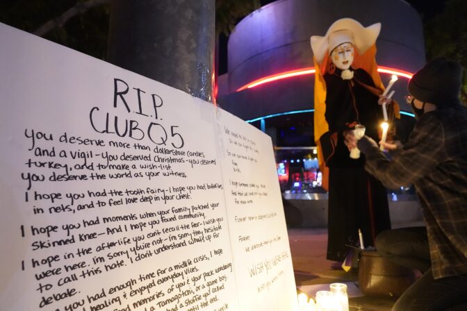 Sister Unity lights candles at a memorial for the victims of Club Q in Colorado Springs, Colo., outside Rocco's WeHo in West Hollywood, Calif., Sunday, Nov. 20, 2022. 
