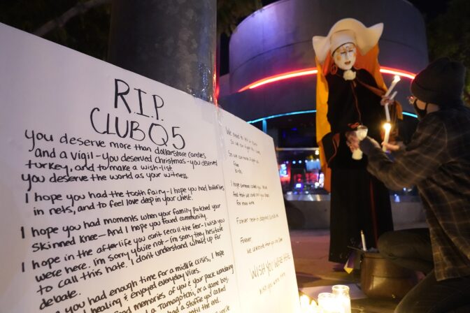Sister Unity lights candles at a memorial for the victims of Club Q in Colorado Springs, Colo., outside Rocco's WeHo in West Hollywood, Calif., Sunday, Nov. 20, 2022.