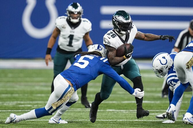 Indianapolis Colts cornerback Stephon Gilmore (5) tackles Philadelphia Eagles running back Miles Sanders (26) in the first half of an NFL football game in Indianapolis, Sunday, Nov. 20, 2022.