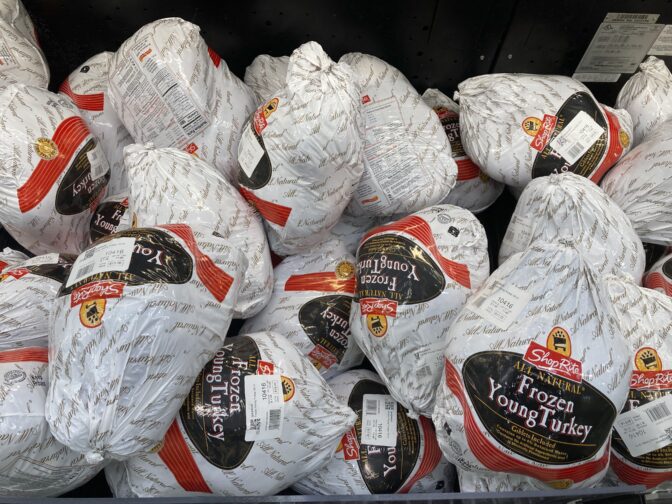 Frozen turkeys are displayed at a supermarket in Philadelphia, Wednesday, Nov. 17, 2021.