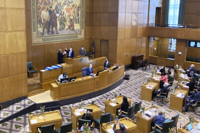 Oregon Chief Justice Martha Walters swears in new House Speaker Dan Rayfield on Tuesday, Feb. 1, 2022, in Salem, Ore.