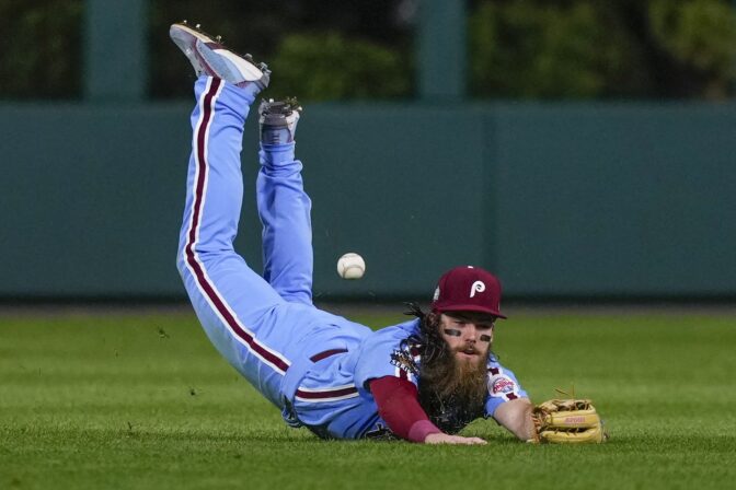 Philadelphia Phillies center fielder Brandon Marsh can't get a glove on a double by Houston Astros' Yuli Gurriel during the seventh inning in Game 5 of baseball's World Series between the Houston Astros and the Philadelphia Phillies on Thursday, Nov. 3, 2022, in Philadelphia.