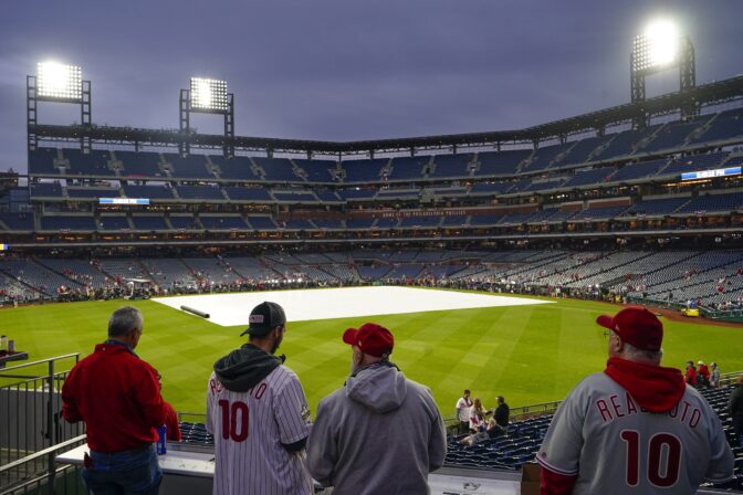 Fans arrive for Game 3 of baseball's World Series between the Houston Astros and the Philadelphia Phillies on Monday, Oct. 31, 2022, in Philadelphia. The game was postponed by rain Monday night with the matchup tied 1-1.