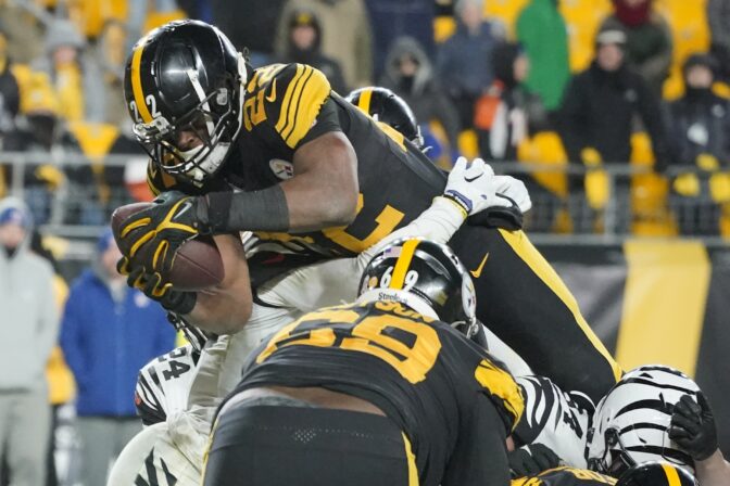 Pittsburgh Steelers running back Najee Harris (22) goes over the top to score a touchdown against the Cincinnati Bengals during the second half of an NFL football game, Sunday, Nov. 20, 2022, in Pittsburgh. The Bengals won 37-30.
