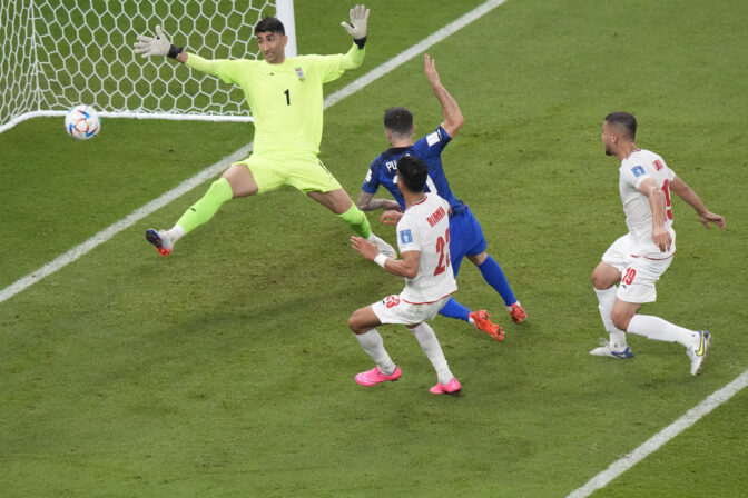 Christian Pulisic of the United States scores his side's opening goal during the World Cup group B soccer match between Iran and the United States at the Al Thumama Stadium in Doha, Qatar, Tuesday, Nov. 29, 2022.