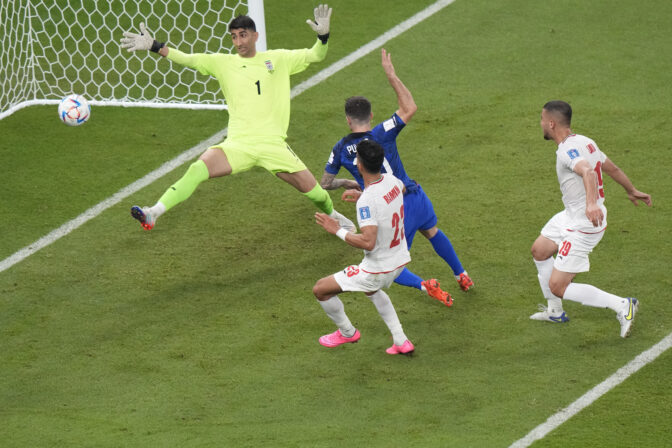 Christian Pulisic of the United States scores his side's opening goal during the World Cup group B soccer match between Iran and the United States at the Al Thumama Stadium in Doha, Qatar, Tuesday, Nov. 29, 2022.